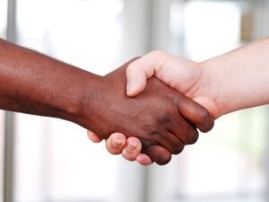 a close-up of a handshake: Hiring Workers in Nicaragua